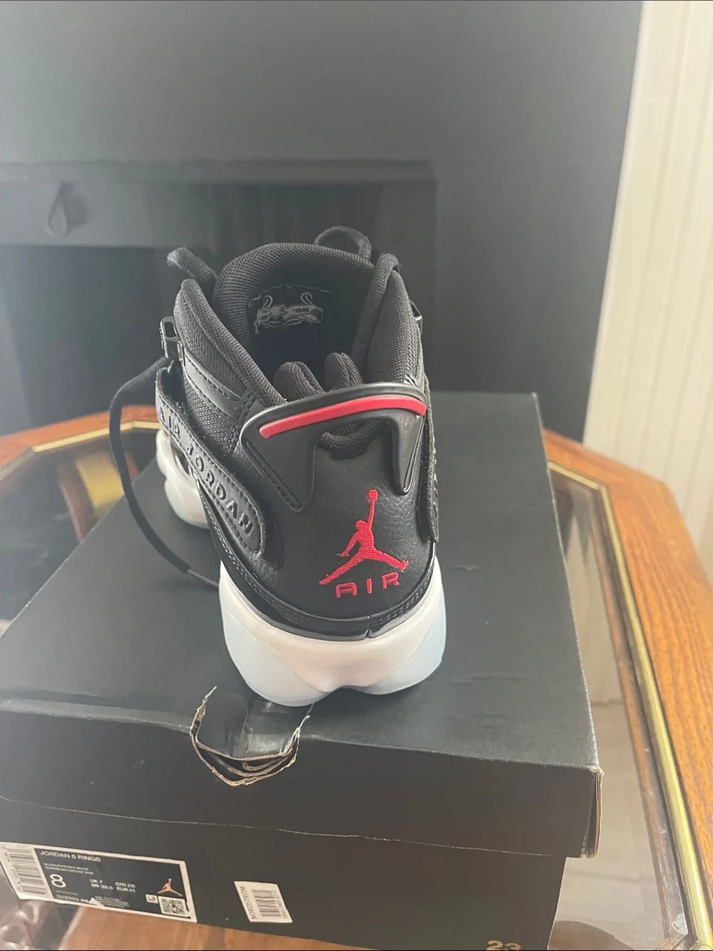 Jordan men’sHigh-Top Sneakers in Black with Red Accents